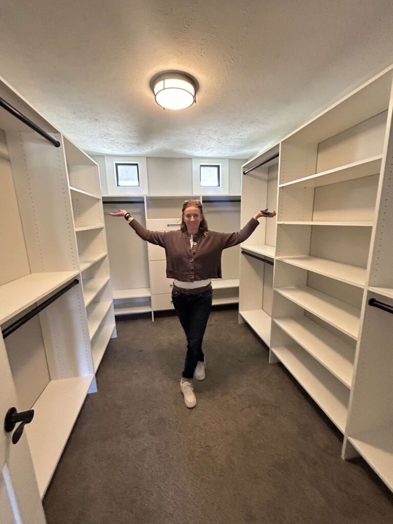 Up Closets franchise owner standing in a closet she created for a client