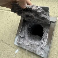 dryer vent cleaning exposing lots of lint built up in the vent
